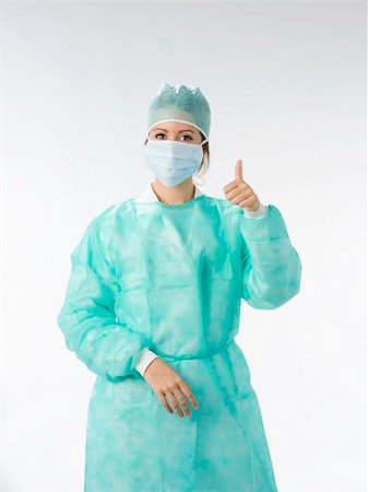 simsearch:400-05060422,k - nurse in operation dress taking poses Stock Photo - Budget Royalty-Free & Subscription, Code: 400-04492112