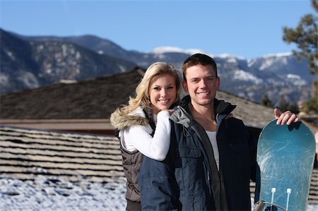 snowboard women blonde - Happy couple at ski resort Stock Photo - Budget Royalty-Free & Subscription, Code: 400-04492459