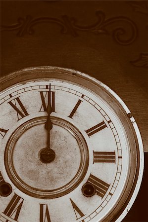 An Antique Clock Face in a brown sepia tone. Stock Photo - Budget Royalty-Free & Subscription, Code: 400-04492500