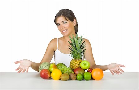 Beautiful young woman with a lot of healhty fruits on her front Stock Photo - Budget Royalty-Free & Subscription, Code: 400-04492696