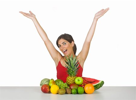 Beautiful young woman with both arms opend and with a lot of healhty fruits Stock Photo - Budget Royalty-Free & Subscription, Code: 400-04492693