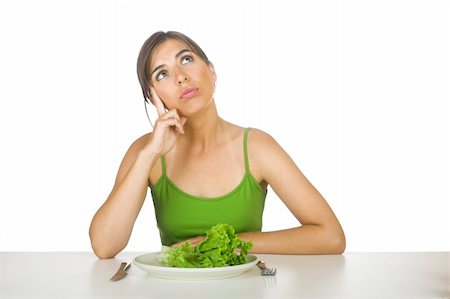 Beautiful woman in diet tired of eating lettuces all day Stock Photo - Budget Royalty-Free & Subscription, Code: 400-04492703