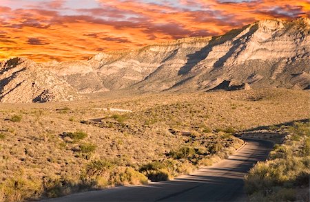 dirt road with sunset - Road leading into Red Rock Canyon with blue sky. Stock Photo - Budget Royalty-Free & Subscription, Code: 400-04493034