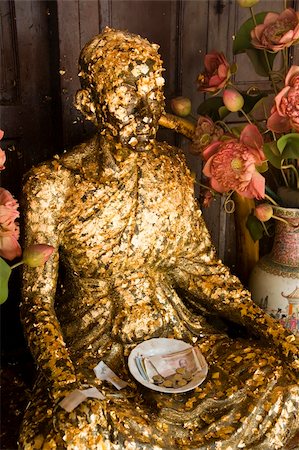Buddha covered with gold leaf offerings at Wat Trai Mit in Bangkok, Thailand. Stock Photo - Budget Royalty-Free & Subscription, Code: 400-04493203