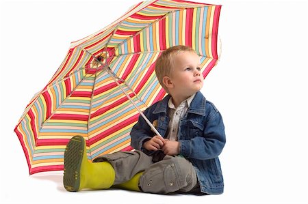 This boy is not happy, as the rain is coming. He's going to need his umbrella. Fotografie stock - Microstock e Abbonamento, Codice: 400-04493322