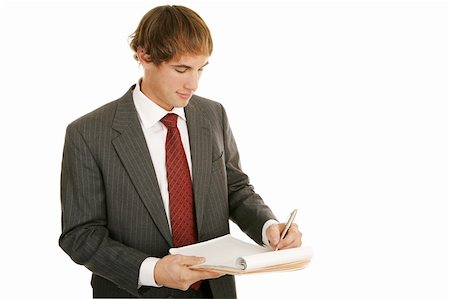Handsome young businessman taking notes.  Isolated on white. Stock Photo - Budget Royalty-Free & Subscription, Code: 400-04493349
