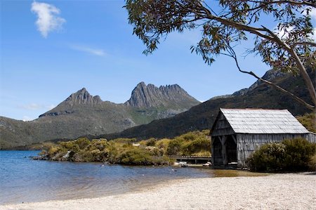 simsearch:400-04493526,k - An old boathouse rests by the calm lakeside at Cradle Mountain in Australia's wild state of Tasmania. Stock Photo - Budget Royalty-Free & Subscription, Code: 400-04493526