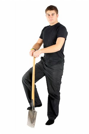 young man in black is holding shovel Stock Photo - Budget Royalty-Free & Subscription, Code: 400-04493633