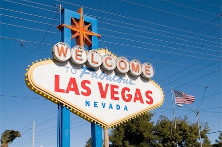 Welcome to fabulous Las Vegas sign with some amazing electrical wiring and American flag in background Stock Photo - Budget Royalty-Free & Subscription, Code: 400-04493695