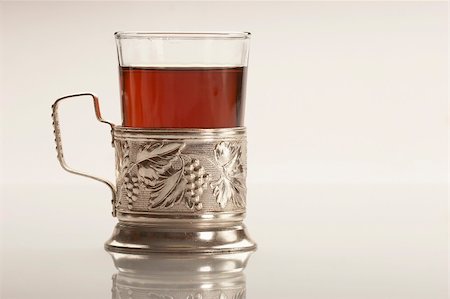 glass of tea in glass-holder Foto de stock - Super Valor sin royalties y Suscripción, Código: 400-04493719