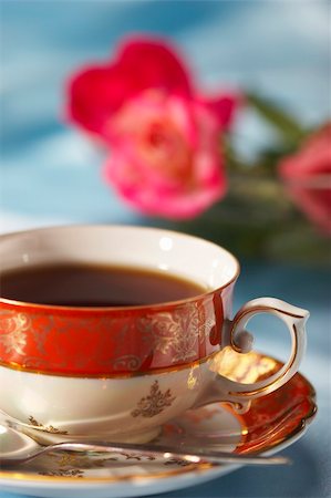 cup of tea with flower over blue background Stock Photo - Budget Royalty-Free & Subscription, Code: 400-04493731