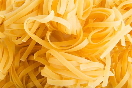 simsearch:400-03986789,k - Tagliatelle pasta rolls background texture Photographie de stock - Aubaine LD & Abonnement, Code: 400-04493936