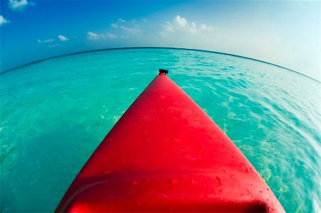 passtime - tropical beach: red canoa on the seashore Stock Photo - Budget Royalty-Free & Subscription, Code: 400-04504072