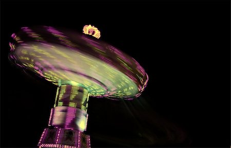 simsearch:700-01259924,k - Merry-go-round at night in purple and green Photographie de stock - Aubaine LD & Abonnement, Code: 400-04505969