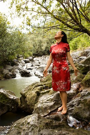 Portrait of Asian American woman in ethnic attire standing on rock by creek in Maui, Hawaii. Stock Photo - Budget Royalty-Free & Subscription, Code: 400-04505996