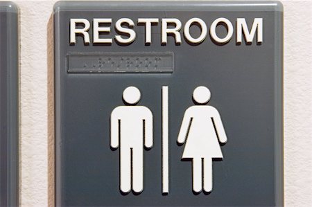 Unisex restroom sign hanging on wall. Contains braille characters. Stockbilder - Microstock & Abonnement, Bildnummer: 400-04506054