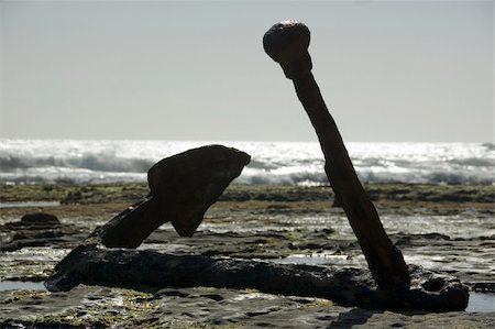 A large anchor from a 1800's sailing ship that was shipwrecked on the rocks Stock Photo - Budget Royalty-Free & Subscription, Code: 400-04506247