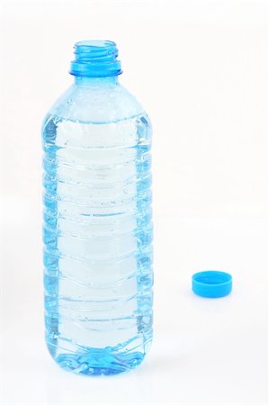 simsearch:400-05028239,k - open plastic bottle with water and cup behind Stockbilder - Microstock & Abonnement, Bildnummer: 400-04506398