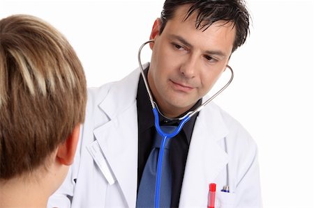 A sick young  patient is being examined by a medical practitioner who is  using a stethoscope.  With horizontal space for copy Stock Photo - Budget Royalty-Free & Subscription, Code: 400-04506951