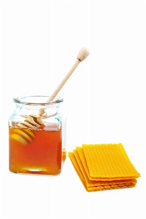 simsearch:400-06387884,k - A wooden drizzler inside of honey jar and honeycomb on white background Stock Photo - Budget Royalty-Free & Subscription, Code: 400-04507395