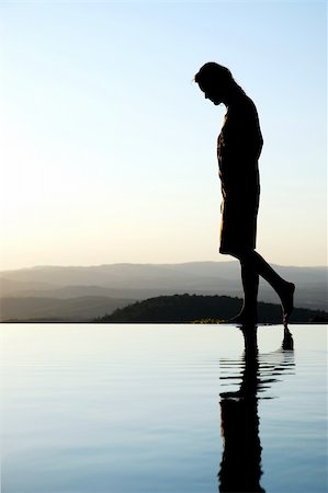 girl standing on the ledge where water ends Stock Photo - Budget Royalty-Free & Subscription, Code: 400-04507403