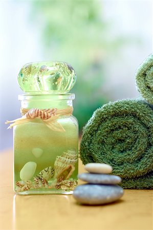 simsearch:400-04881211,k - Spa and wellness: green towels in bathroom; stacked stones and aromatherapy salt Stock Photo - Budget Royalty-Free & Subscription, Code: 400-04507457