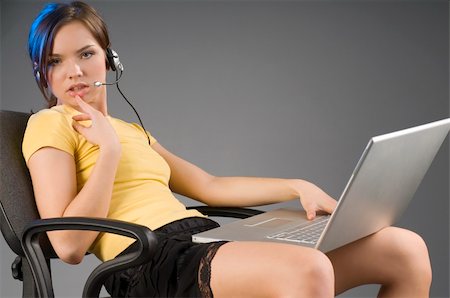 simsearch:400-03996852,k - attractive girl with laptop on legs and earphone in a sexy pose Stockbilder - Microstock & Abonnement, Bildnummer: 400-04507480
