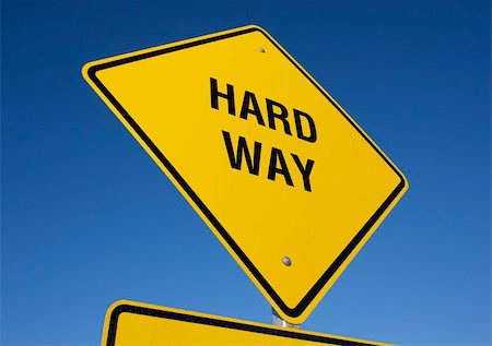 simsearch:693-06325297,k - Hard Way road sign with deep blue sky background. Contains clipping path. Foto de stock - Super Valor sin royalties y Suscripción, Código: 400-04507846