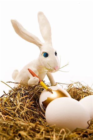 simsearch:400-05040794,k - The white rabbit paints egg in gold colour in a nest Stock Photo - Budget Royalty-Free & Subscription, Code: 400-04508578