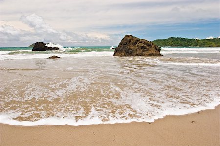 simsearch:862-06542597,k - Photo of a wide wave at the beach on the Pacific Coast of Costa Rica. Stock Photo - Budget Royalty-Free & Subscription, Code: 400-04508723