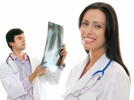 simsearch:400-04508758,k - Smiling female nurse or doctor and a male doctor holding up an x-ray Foto de stock - Super Valor sin royalties y Suscripción, Código: 400-04508757