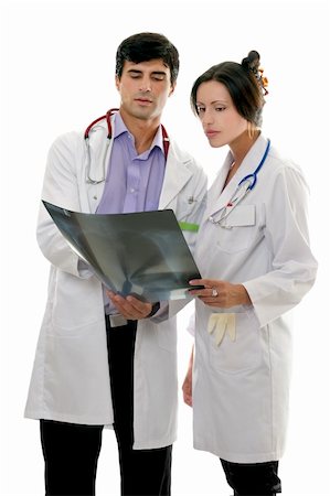 Two medical doctors discuss a patient's x-ray result. Stock Photo - Budget Royalty-Free & Subscription, Code: 400-04508758