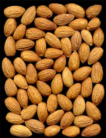 edible oil - Dry almonds kernel on black background from the top Stock Photo - Budget Royalty-Free & Subscription, Code: 400-04508773