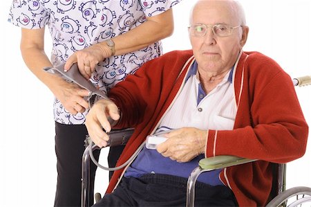 nurse checking elderly patients blood pressure Stock Photo - Budget Royalty-Free & Subscription, Code: 400-04508811