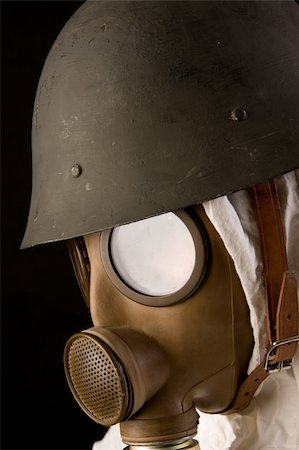 Military person in gas mask and helmet on black background Stock Photo - Budget Royalty-Free & Subscription, Code: 400-04508874