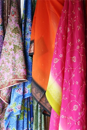 Colorful saris hanging in an Asian market. Foto de stock - Super Valor sin royalties y Suscripción, Código: 400-04509023