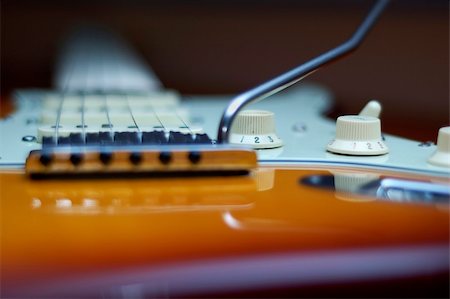 pickup truck materials - Close-up of a Fender American Deluxe guitar knobs and bridge Stock Photo - Budget Royalty-Free & Subscription, Code: 400-04509060