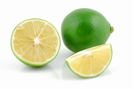 simsearch:400-04395073,k - Fresh lime, halved and cutted in isolated white background Stock Photo - Budget Royalty-Free & Subscription, Code: 400-04509272