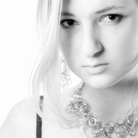 simsearch:400-05041629,k - Young girl in a dress in the studio on a white background. Fotografie stock - Microstock e Abbonamento, Codice: 400-04509445