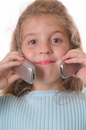 simsearch:400-06517383,k - young girl talking on two cellphones Fotografie stock - Microstock e Abbonamento, Codice: 400-04509573