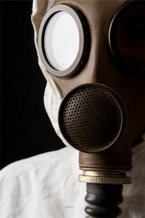 Person in gas mask on dark background Stock Photo - Budget Royalty-Free & Subscription, Code: 400-04509682