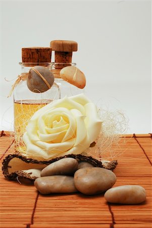 smithesmith (artist) - Bottle with aromatic oil soap  for wellness and Zen stones Photographie de stock - Aubaine LD & Abonnement, Code: 400-04509871