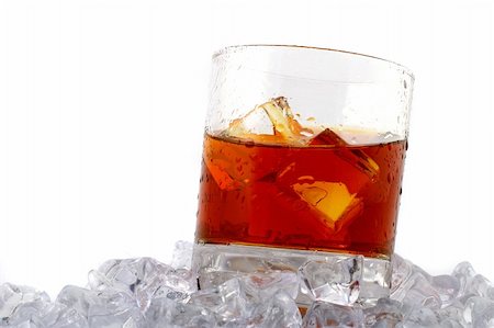 distillation whiskey - glass of whiskey with ice cubes on white background Stock Photo - Budget Royalty-Free & Subscription, Code: 400-04500127