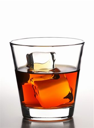 glass of whiskey with ice cubes on white background Stock Photo - Budget Royalty-Free & Subscription, Code: 400-04500129