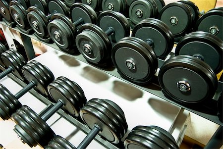 simsearch:400-04329882,k - Closeup of a row of free weights in the gym Stock Photo - Budget Royalty-Free & Subscription, Code: 400-04500218