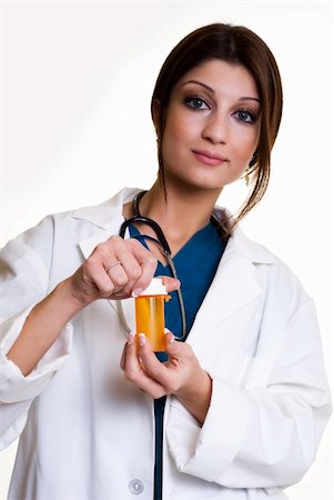 simsearch:400-03995908,k - Confident pretty woman healthcare worker wearing medical uniform holding a medicine bottle standing on white Stock Photo - Budget Royalty-Free & Subscription, Code: 400-04500259