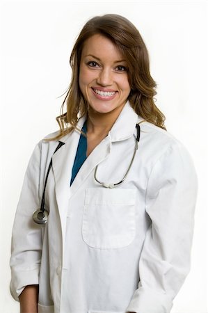 simsearch:400-03995908,k - Female attractive doctor wearing white lab coat with a stethoscope around shoulders smiling standing on white background Stock Photo - Budget Royalty-Free & Subscription, Code: 400-04500269