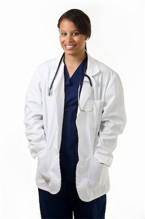 simsearch:400-03995908,k - Female attractive African American doctor wearing white lab coat wearing a stethoscope around shoulders smiling standing on white background Stock Photo - Budget Royalty-Free & Subscription, Code: 400-04500274