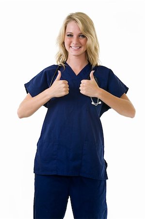 simsearch:400-05172792,k - Young pretty blond woman healthcare worker wearing blue scrubs and a stethoscope holding two thumbs up on white Foto de stock - Royalty-Free Super Valor e Assinatura, Número: 400-04500277