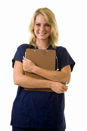 simsearch:400-03995908,k - Pretty young woman healthcare worker wearing blue scrubs and a stethoscope holding a clipboard standing on white Stock Photo - Budget Royalty-Free & Subscription, Code: 400-04500278